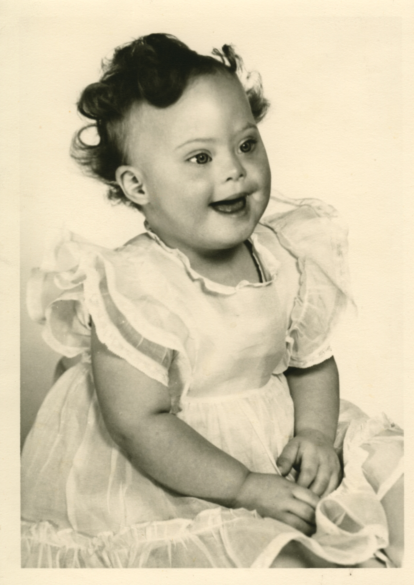 Claudia_2 Young toddler smiling at the camera.