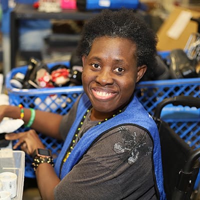 Debbie-600×600 Woman working at a sorting and assembly facility.