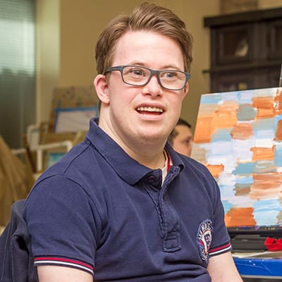 Young man in a blue polo shirt.