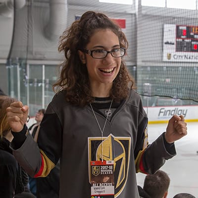 Woman in the stands at a professional hockey game in Las Vegas.