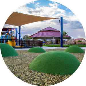 Soft mounds on the ground at an accessible playground in Las Vegas.