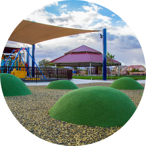 accessible-park Soft mounds on the ground at an accessible playground in Las Vegas.