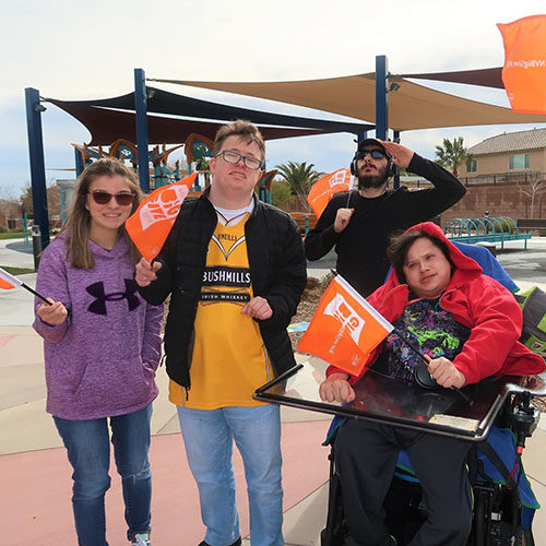 Group of people at an event outside.