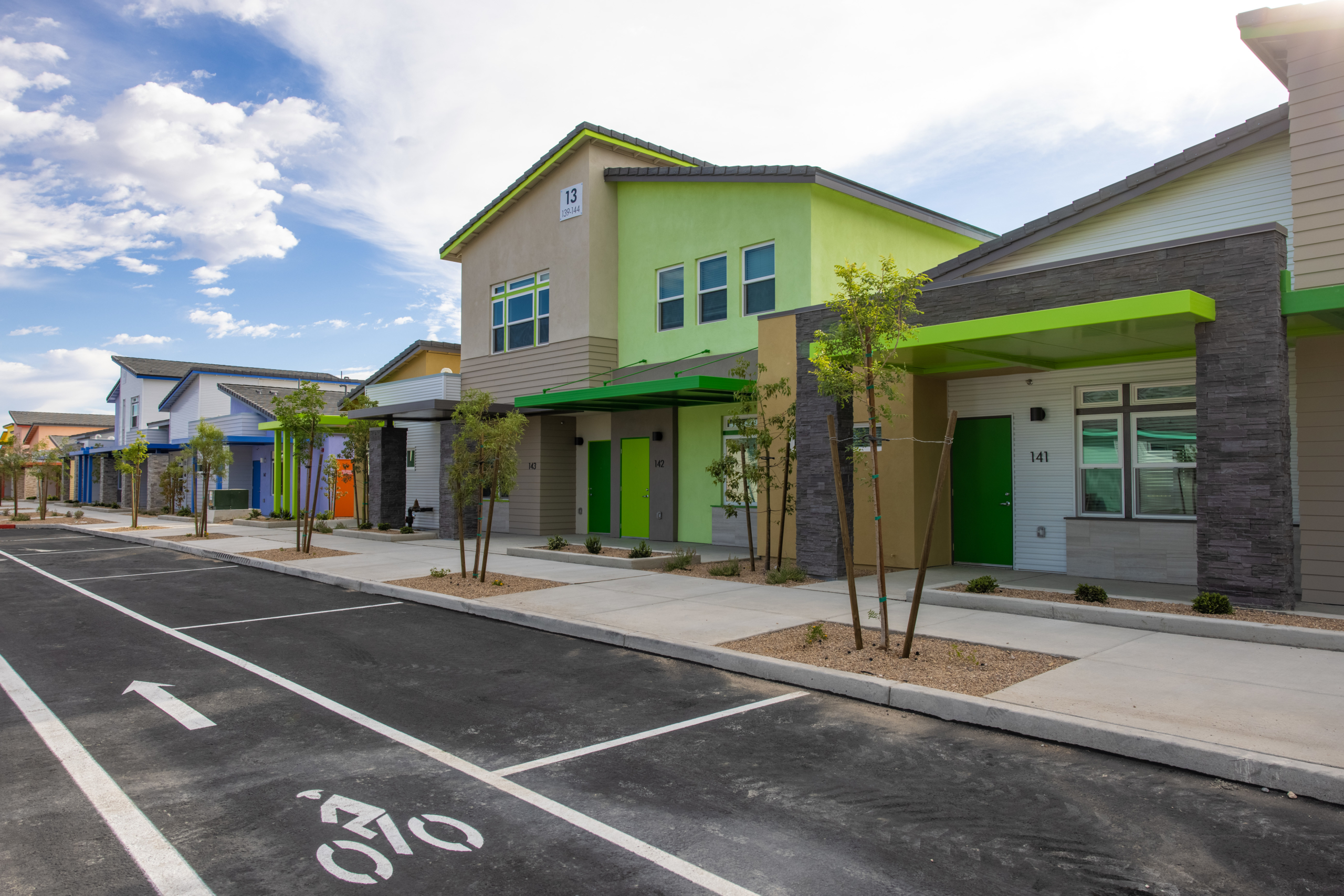 Row of townhomes along a street.