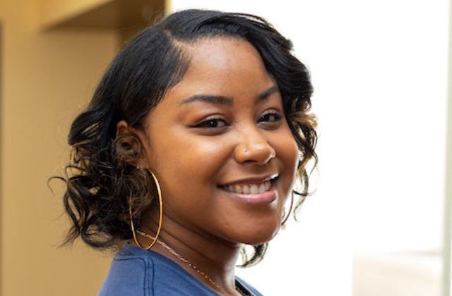 courtneyt-featured-image Image of woman smiling and looking at the camera.