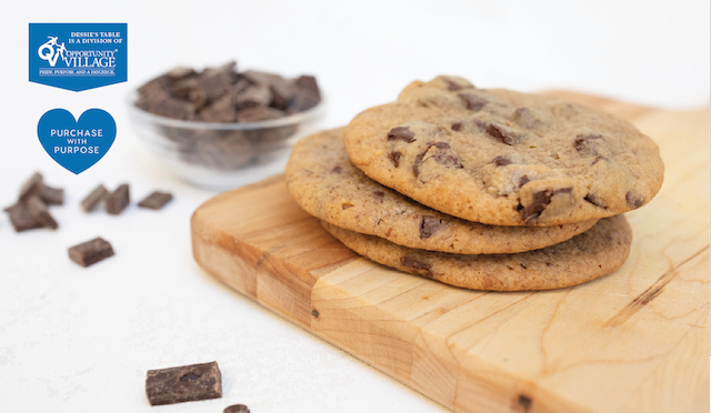 Chocolate chip cookies on wooden board.