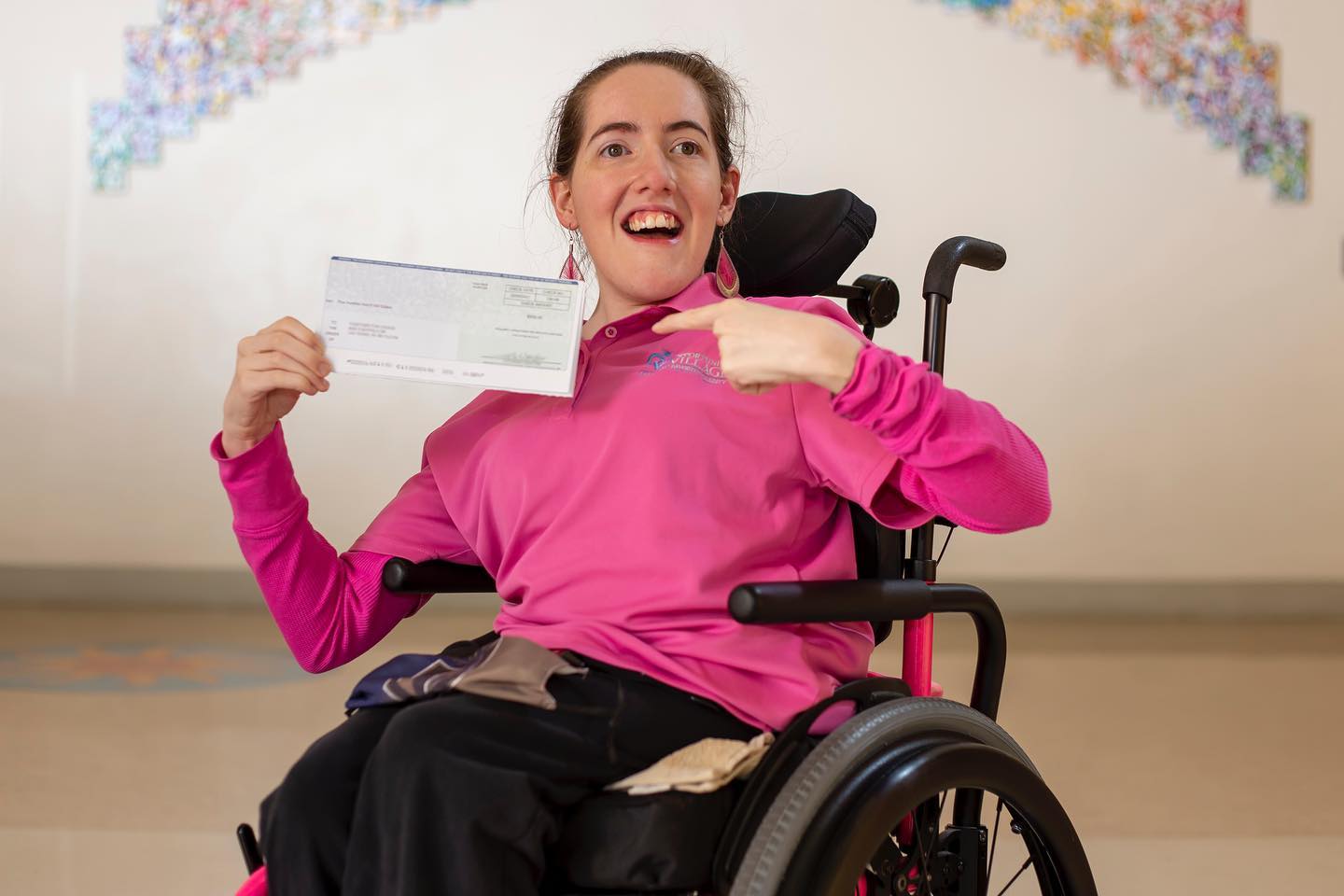 Women holding a donation check.