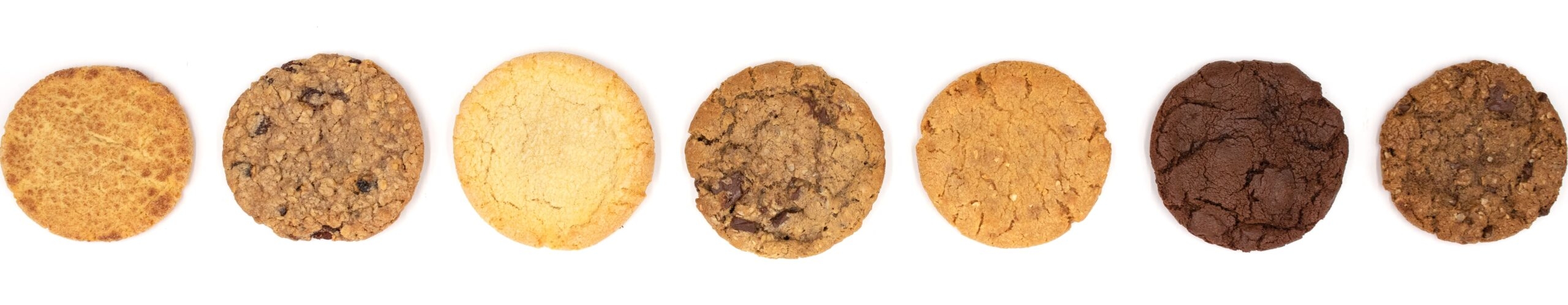 Row of 7 cookies on a white background.