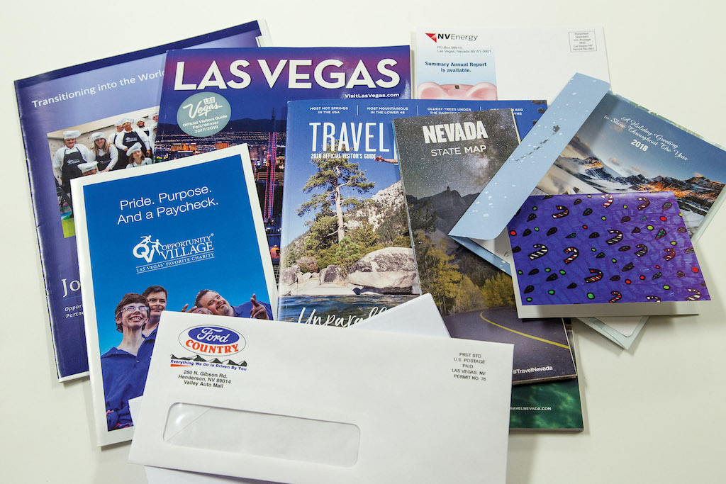 print-shop-samples Assorted printed marketing materials and stationary office papers.