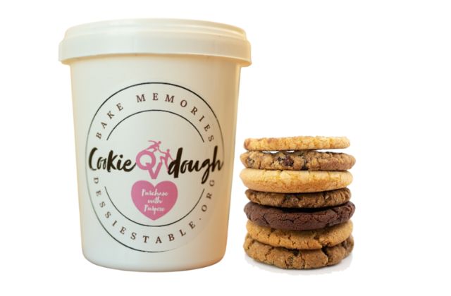 White tub with the text "CookieOVdough, Bake memories, Dessietable.org' with a stack of 6 cookies to the side.
