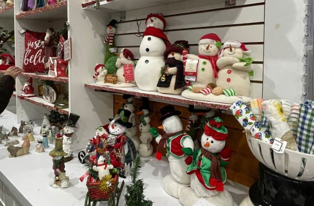 group of Christmas holiday decorations on a display shelf