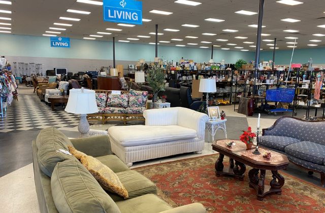 thrift shop filled with clothing and furniture