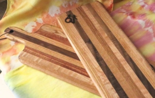 two wood cutting boards on a table