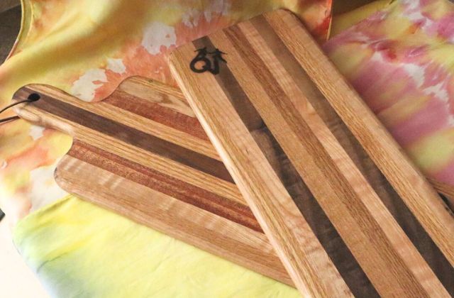 two wood cutting boards on a table