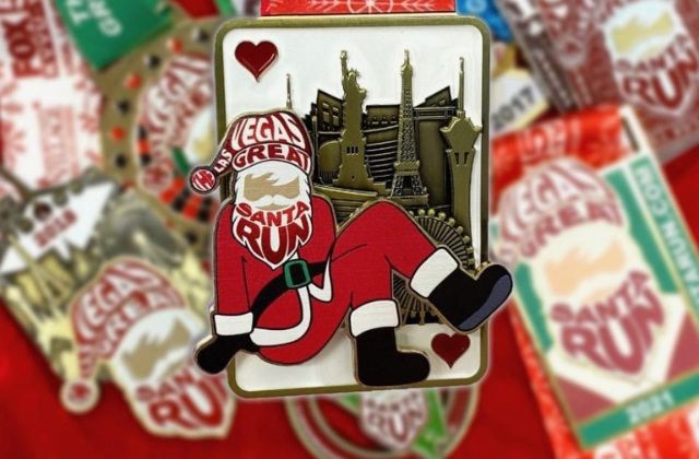 metal race finisher medal with figure in a santa suit with the words 'the las vegas grea santa run' 