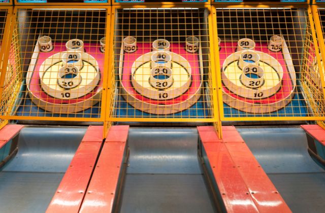 row of three arcade games