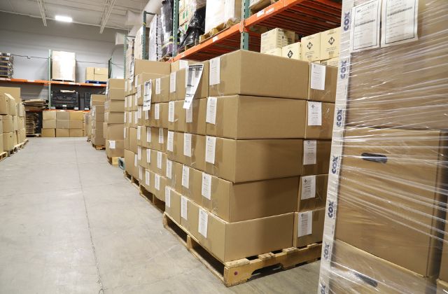 stacks of boxes in a kitting warehouse