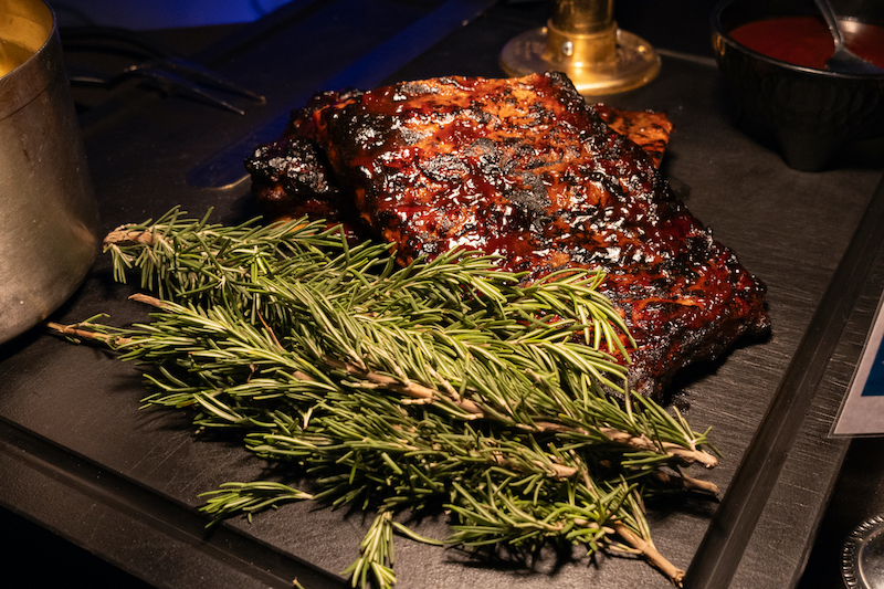 catered ribs on a bed of rosemary twigs
