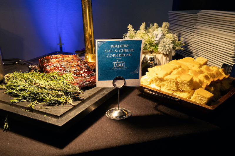 group of catered food items with an menu displayed