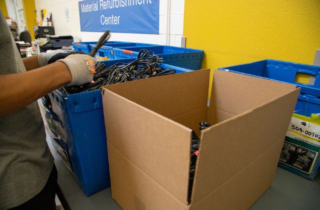 person working on a kitting project with cables