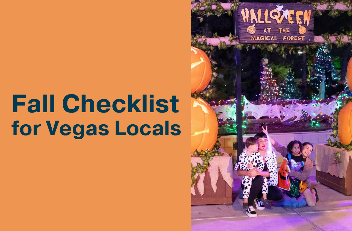 Two adults and two children in Halloween costumes pose in front of a lit "Halloween at the Magical Forest" sign surrounded by giant pumpkins and festive lights.